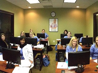 Students sitting in a classroom at Academy of Dental Assisting in KY